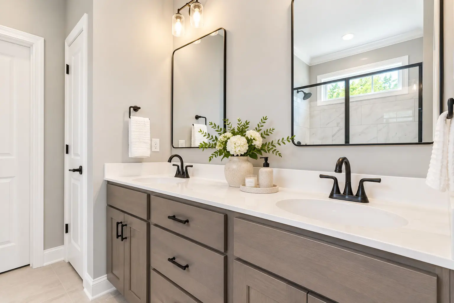 Elegant bathroom with black fixtures and white flowers