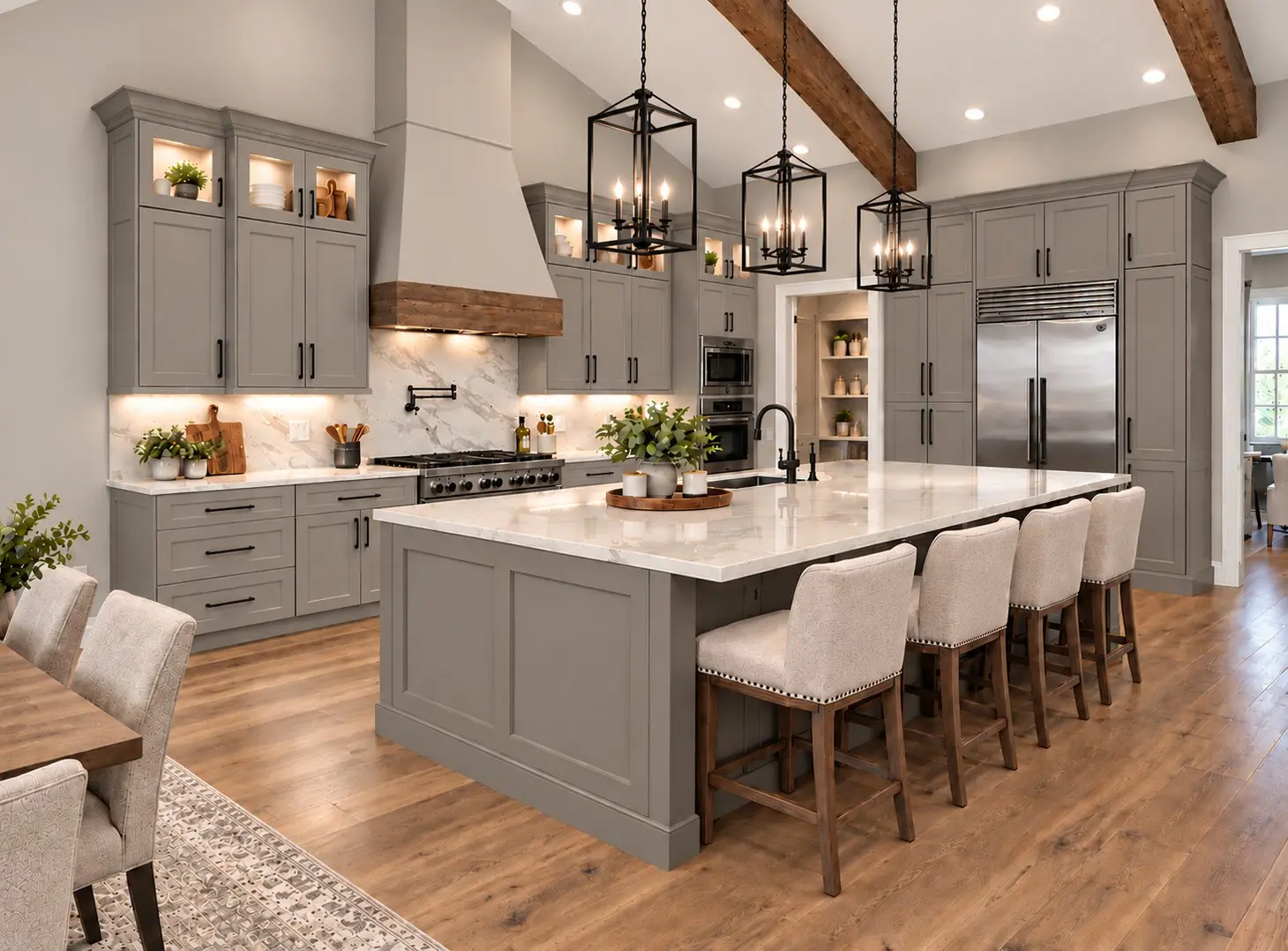 Spacious kitchen with gray cabinets, marble counters